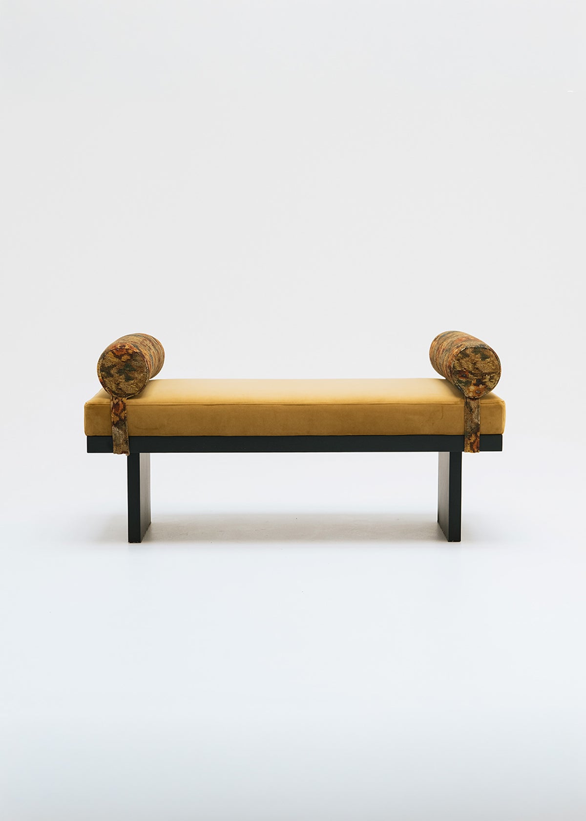 Mustard yellow bench with bolsters