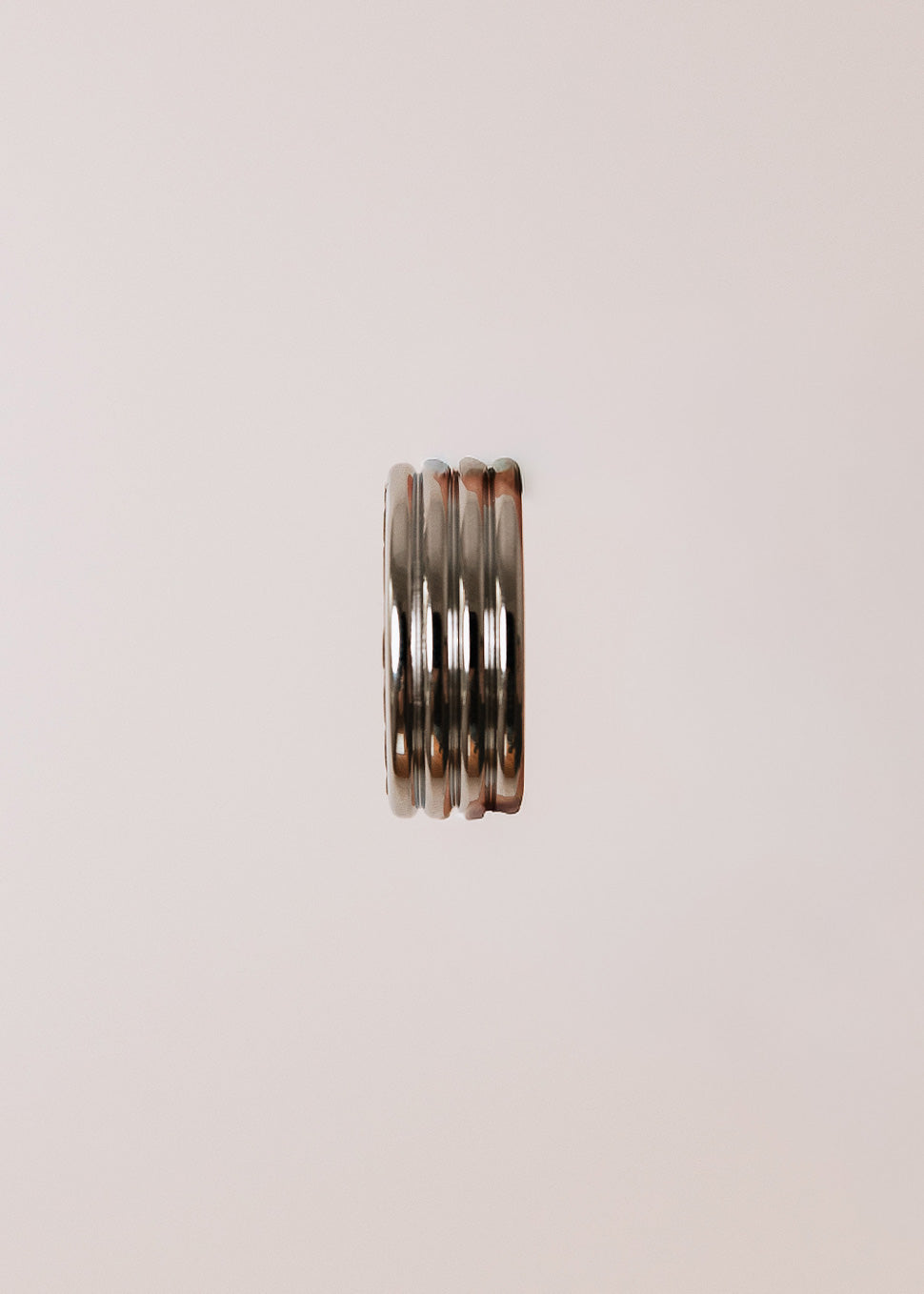 Round metal handle covered in bison leather