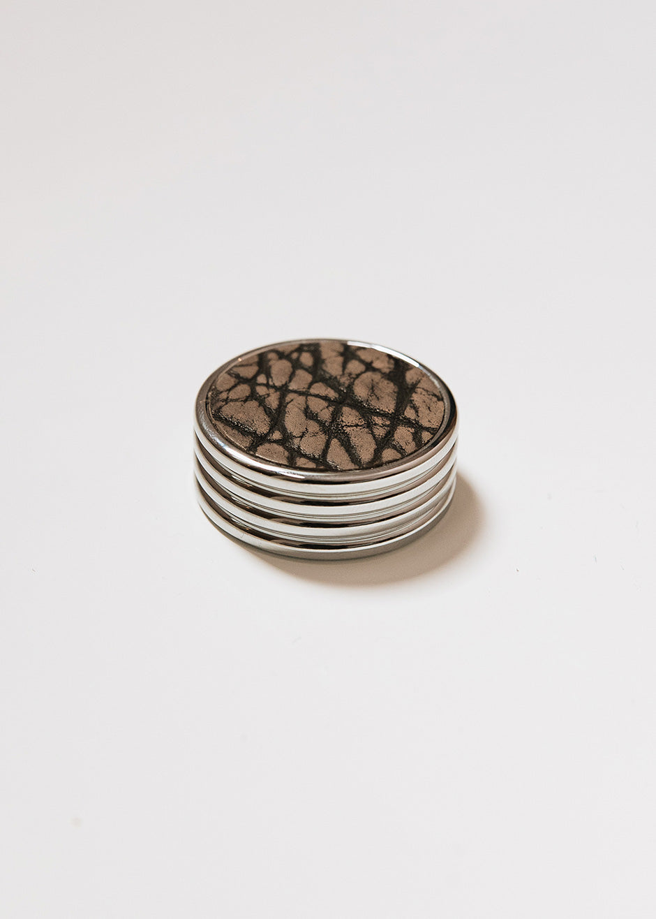 Round metal handle covered in bison leather