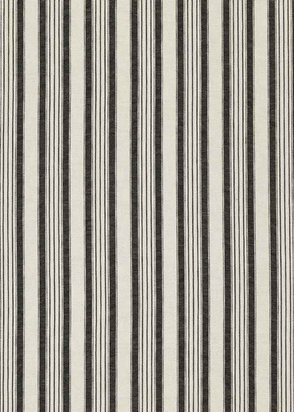 Cabecero individual tapizado en tela estampada de cuadros de rayas.