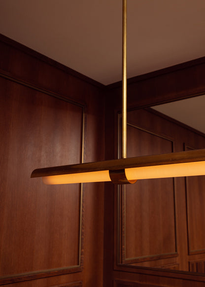 Ceiling lamp in curved raw brass with glazed methacrylate diffuser.