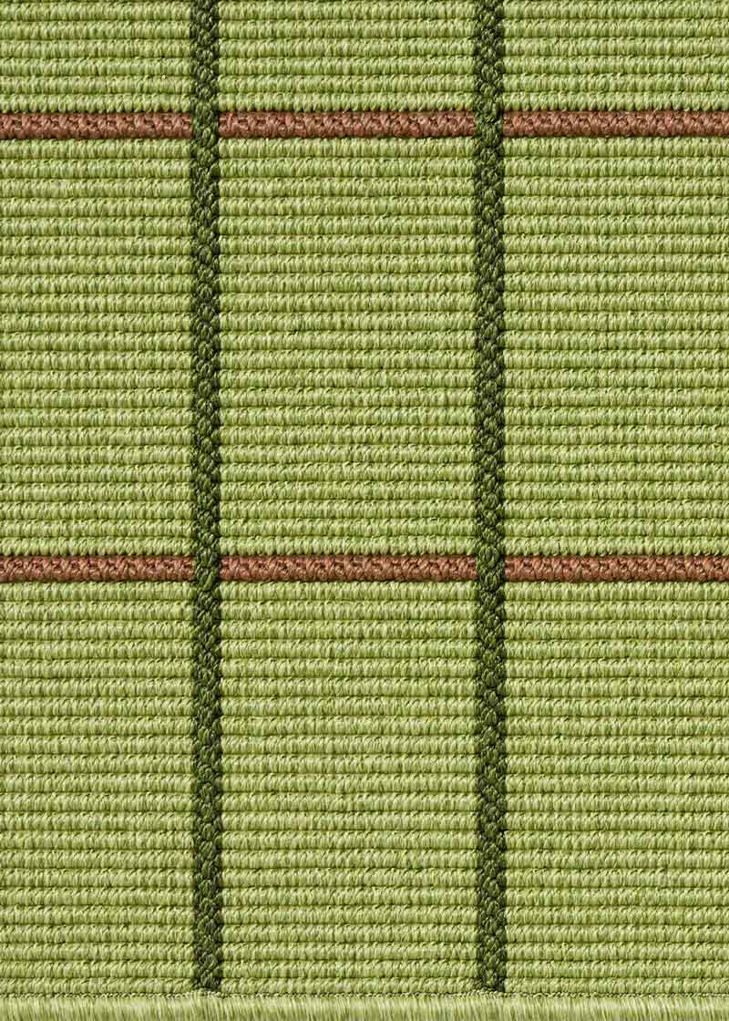 Alfombra fabricada en PET a partir de botellas de plástico recicladas de color verde pistacho en telar wilton de tejido plano.