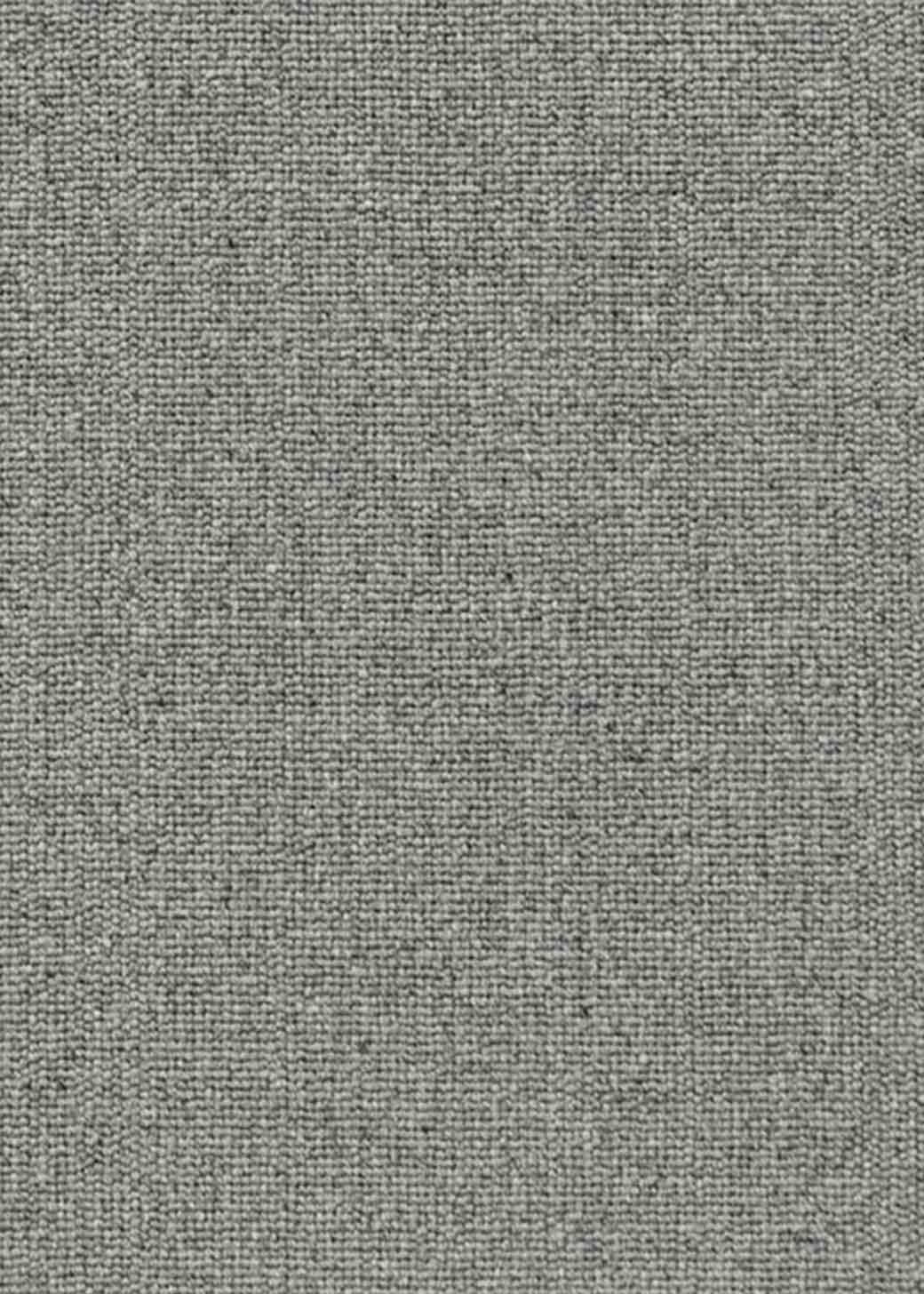 Alfombra fabricada con lana de color gris en telar tufting con superficie en bucle.