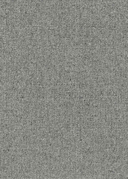 Alfombra fabricada con lana de color gris en telar tufting con superficie en bucle.
