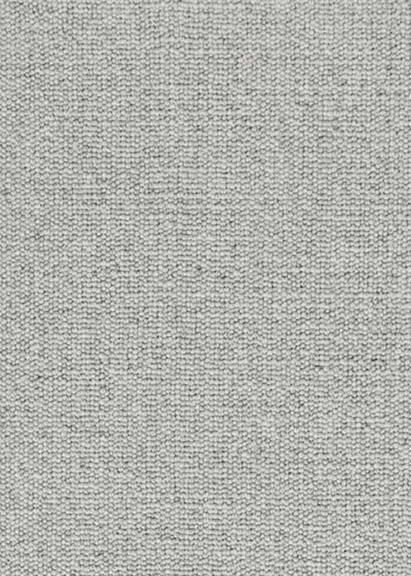 Alfombra fabricada con lana de color gris celeste en telar tufting con superficie en bucle.