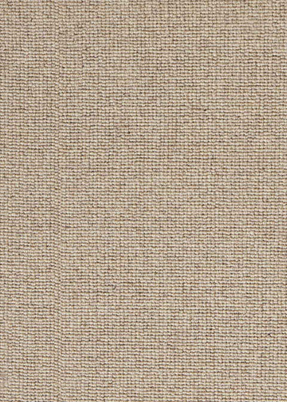 Alfombra fabricada con lana de color topo en telar tufting con superficie en bucle.