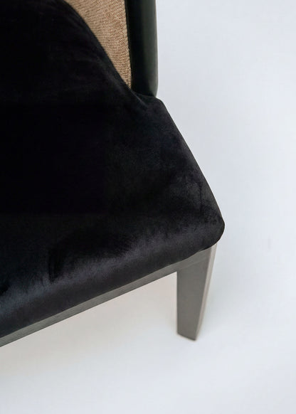 Braided rattan chair with black wood frame