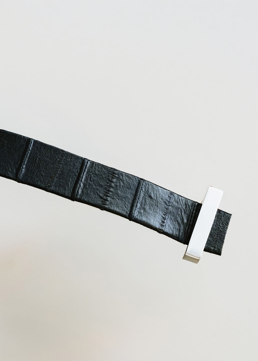 Metal handle finished in eel skin