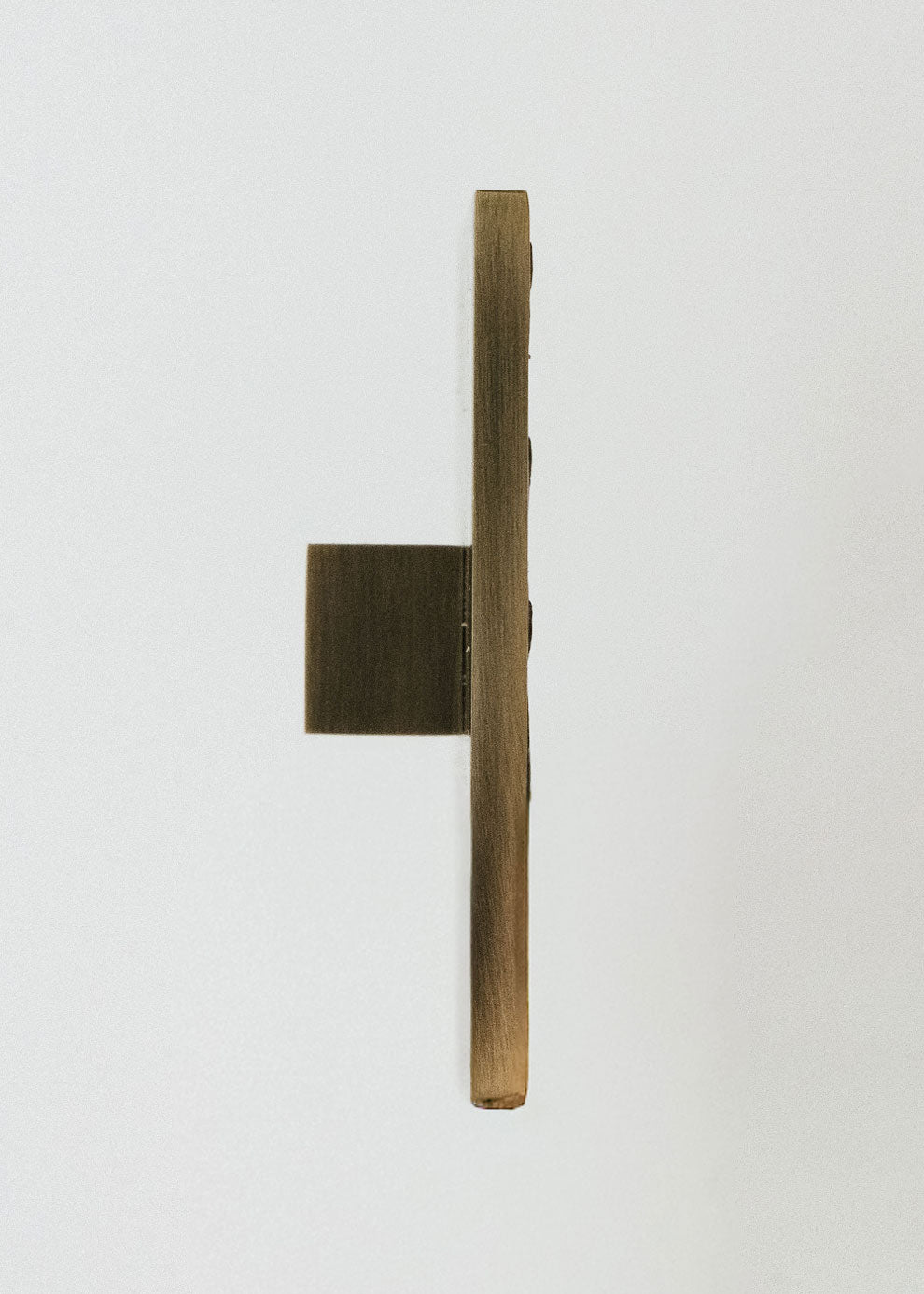 Square metal handle covered in ostrich leather