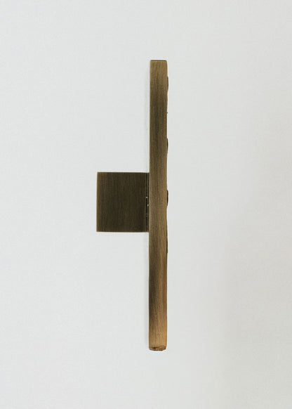 Square metal handle covered in ostrich leather