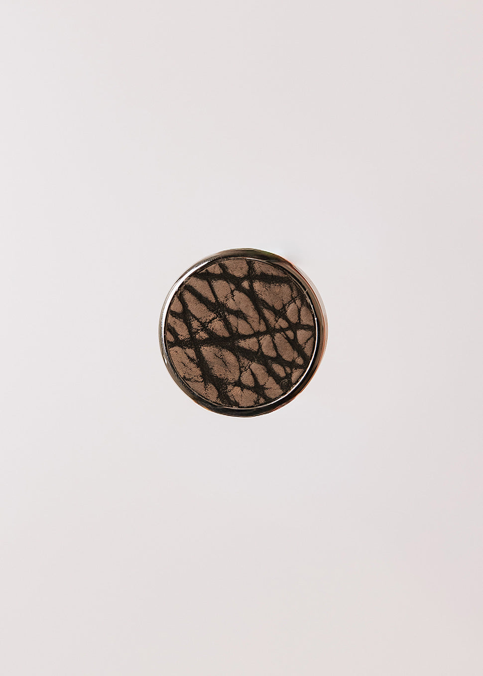 Round metal handle covered in bison leather